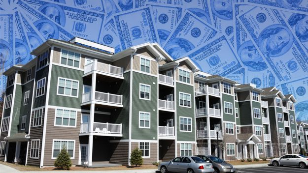 Multi-family apartment complex overlaid with semi-transparent $100 bills representing cash-on-cash returns in real estate